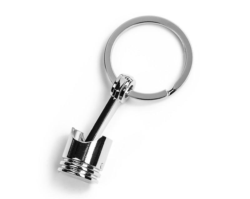 Cheițar cu piston pentru brelocuri