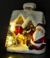 Casa cu Moș Crăciun și iluminat cu LED-uri